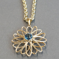 Blue topaz daisy flower pendant 