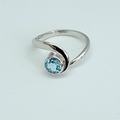 Blue topaz silver swirl ring