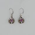 18ct platinum earrings mounted with pink sapphires