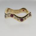 Ruby, diamond and gold wave ring