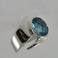 Silver ring with blue topaz