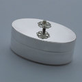 Oval silver box with decorative finial